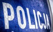 napis Policja na drzwiach radiowozu